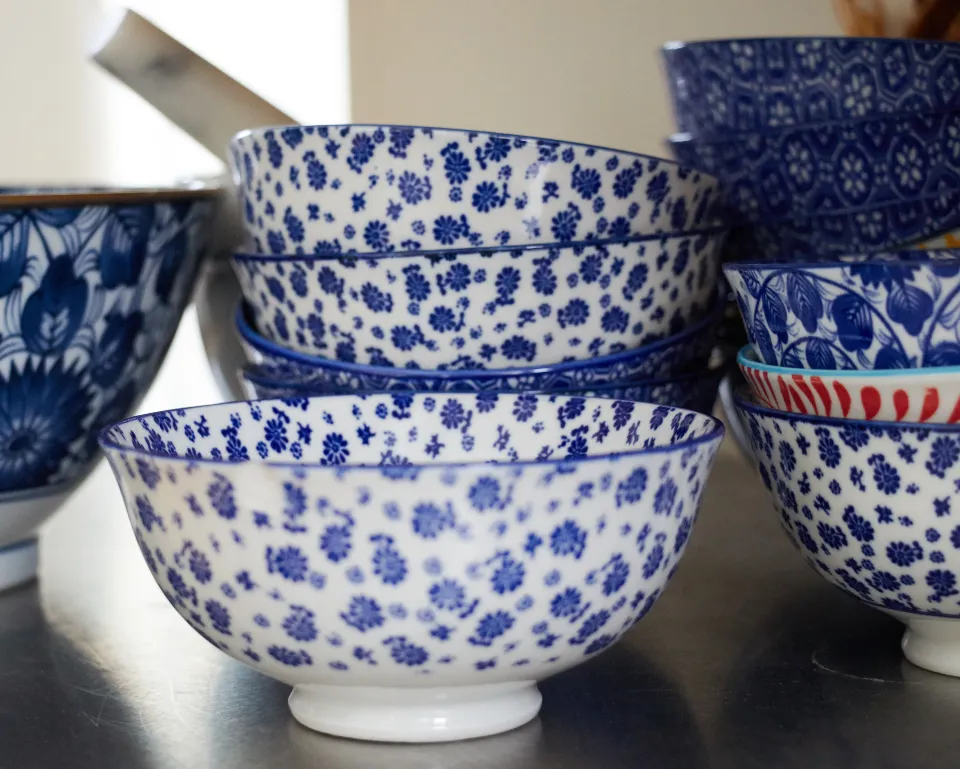 Stacked hand-painted blue and white ceramic bowls